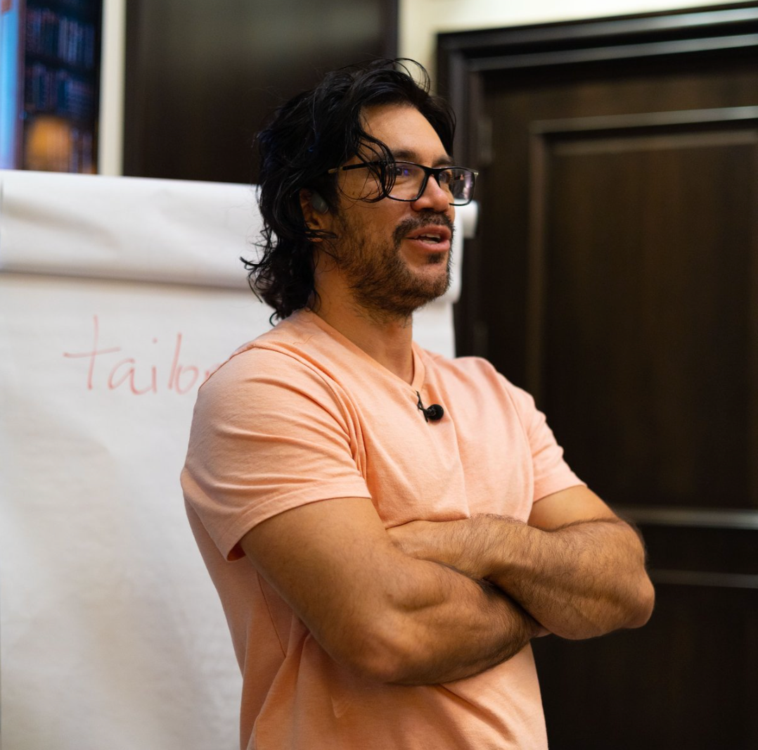 Tai Lopez in front of his 10,000 book library