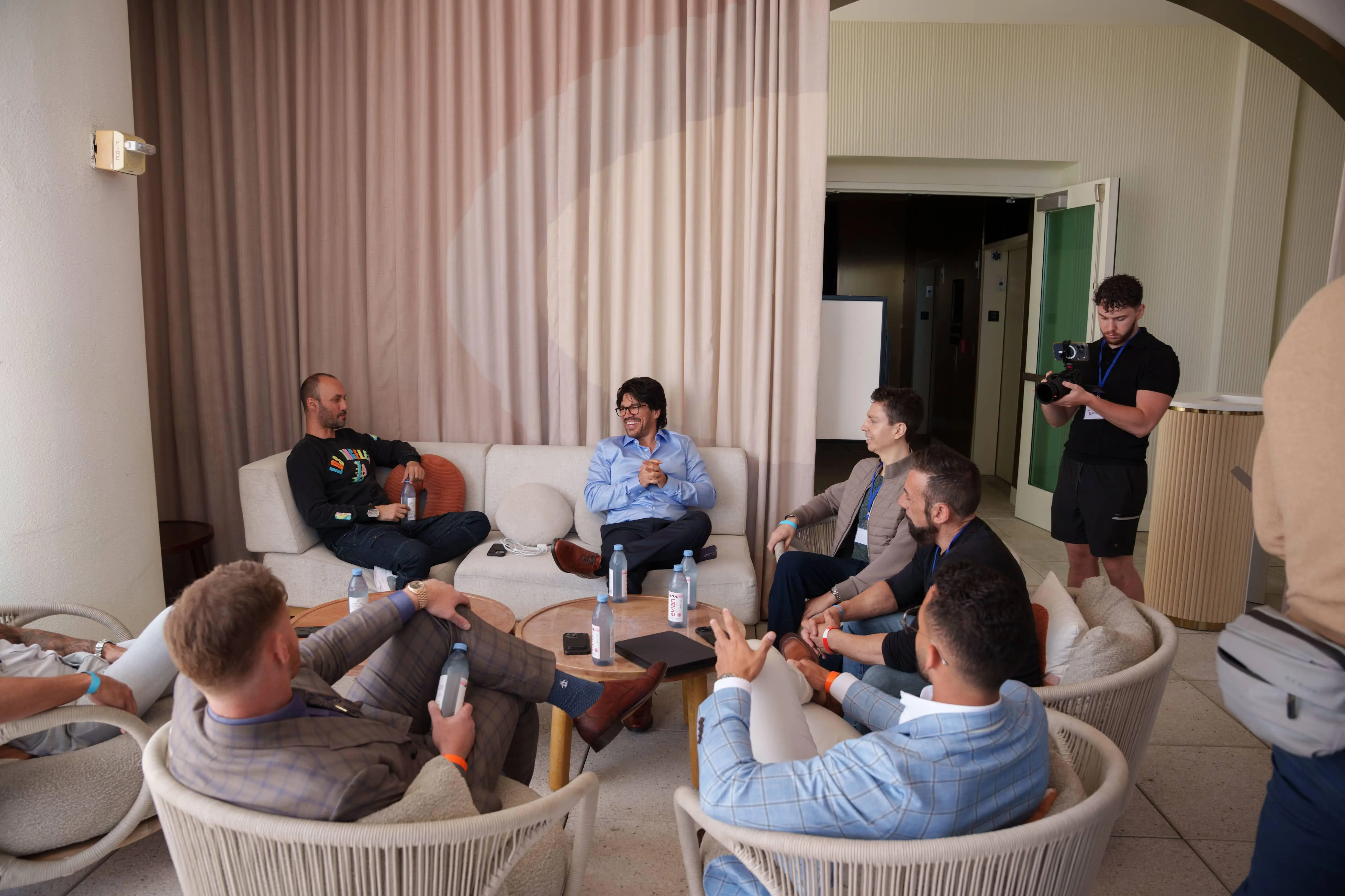 Tai Lopez speaking with attendees in exclusive boardroom lounge